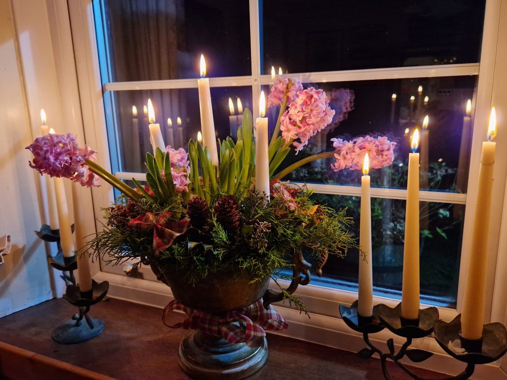 Hyacinths and candles on a windowsill