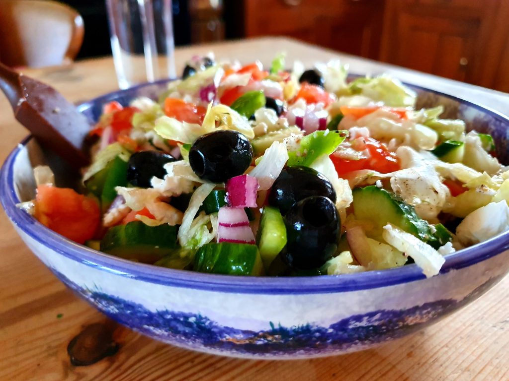 A bowl with salad on a table