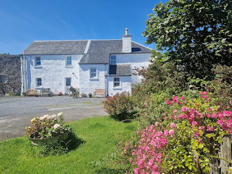 cottages with roses and flowers in the foreground