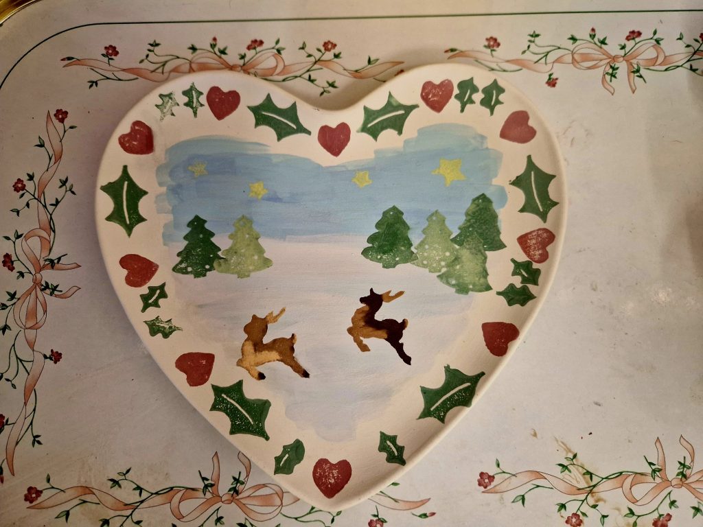 Heart plate with snow and reindeer on it