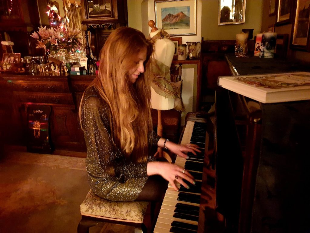 girl playing piano