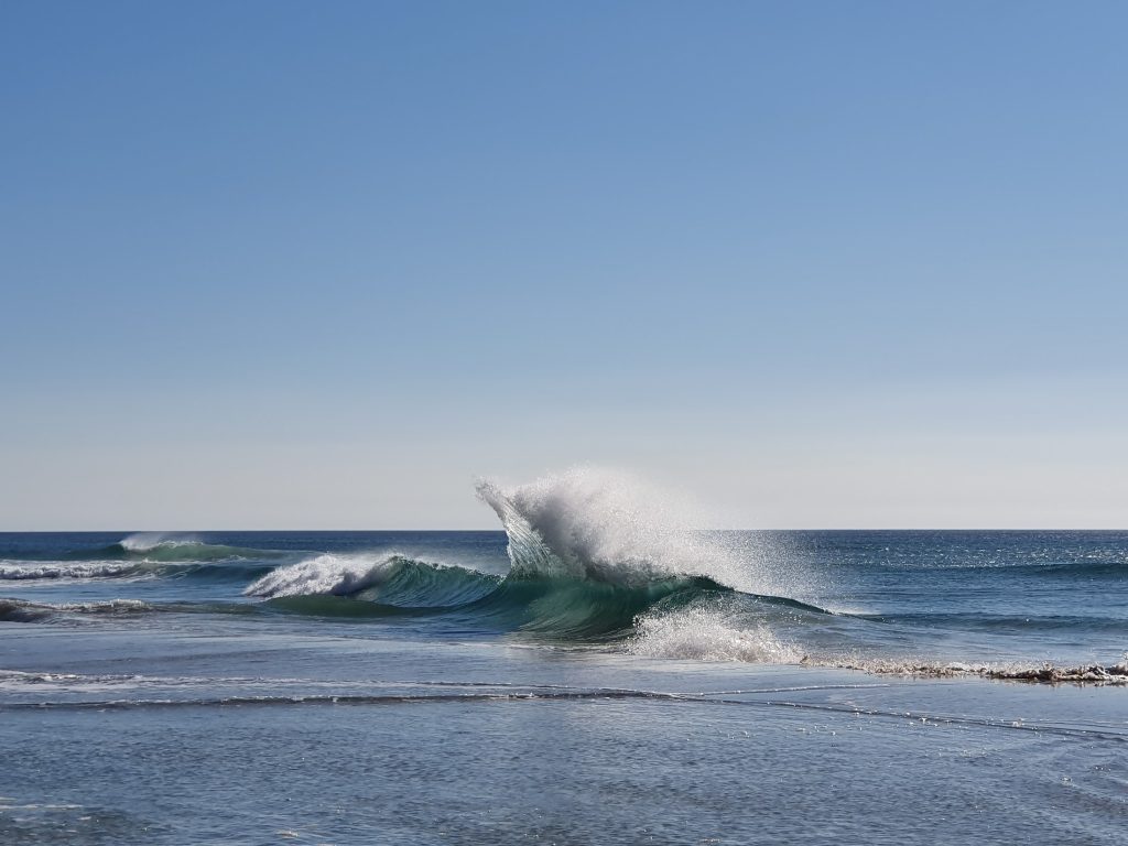 A huge wave breaking out at sea